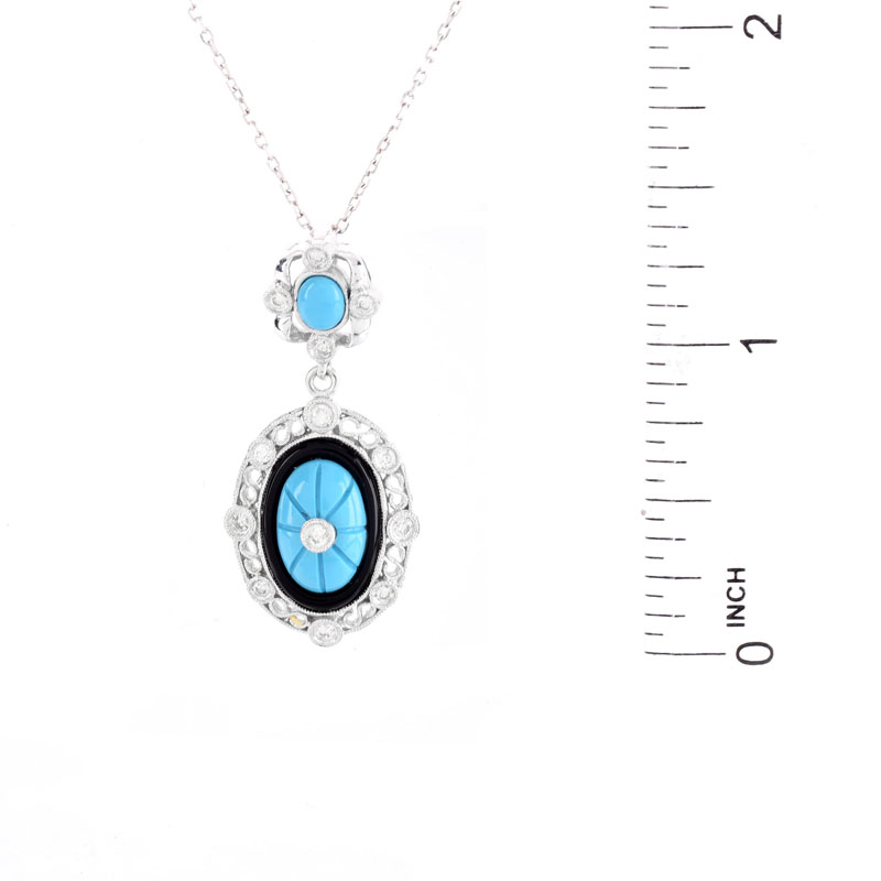 Turquoise, Diamond, Black Onyx and 18 Karat White Gold Pendant Necklace. 