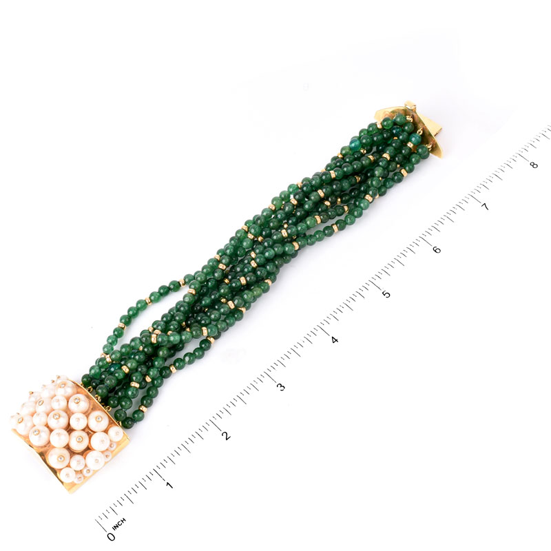 Circa 1950s Multi Strand Emerald Bead, Pearl and 18 Karat Yellow Gold Bracelet. Emerald beads measure 4mm.