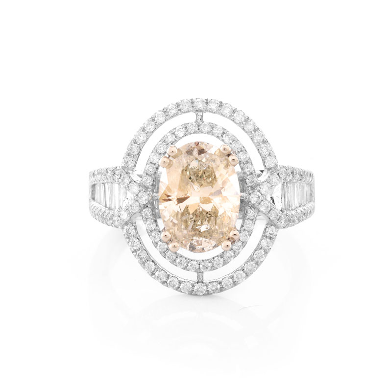 Approx. 1.71 Carat Oval Cut Diamond and 14 Karat White Gold Ring accented throughout with Round Brilliant Cut Diamonds.