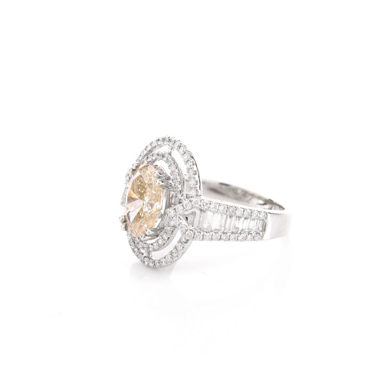 Approx. 1.71 Carat Oval Cut Diamond and 14 Karat White Gold Ring accented throughout with Round Brilliant Cut Diamonds.