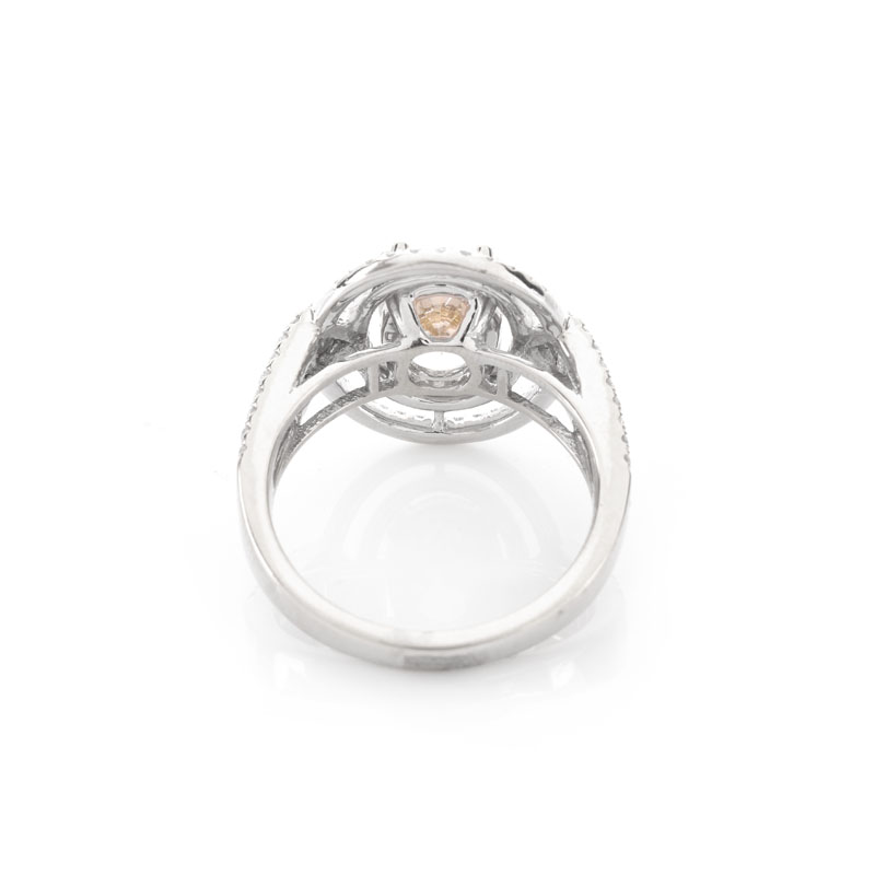 Approx. 1.71 Carat Oval Cut Diamond and 14 Karat White Gold Ring accented throughout with Round Brilliant Cut Diamonds.