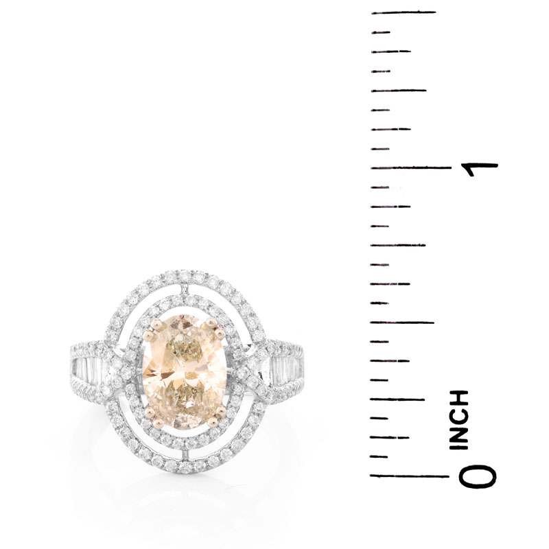 Approx. 1.71 Carat Oval Cut Diamond and 14 Karat White Gold Ring accented throughout with Round Brilliant Cut Diamonds.