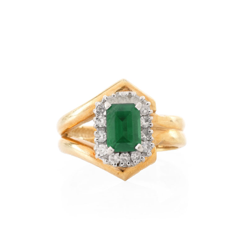 Vintage Emerald, Diamond and 14 Karat Yellow Gold Ring. Emerald measures 7 x 5mm. Stamped 14K. Good vintage condition.