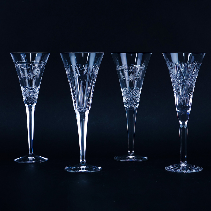 Four (4) Tall Waterford Crystal Champagne Flutes. Signed.