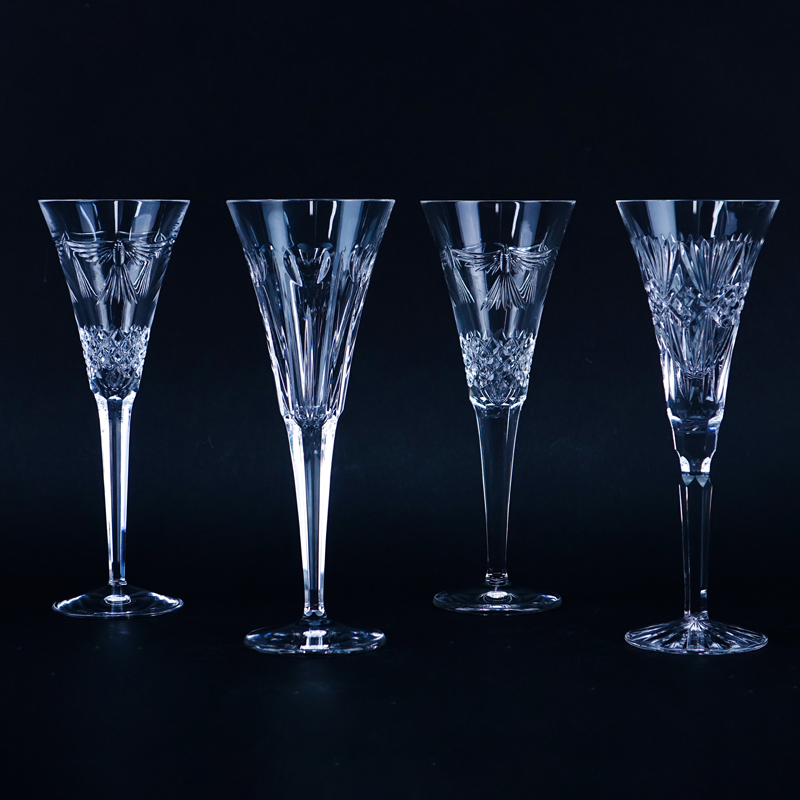 Four (4) Tall Waterford Crystal Champagne Flutes. Signed. Kodner Auctions