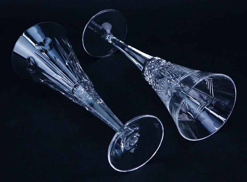 Four (4) Tall Waterford Crystal Champagne Flutes. Signed.