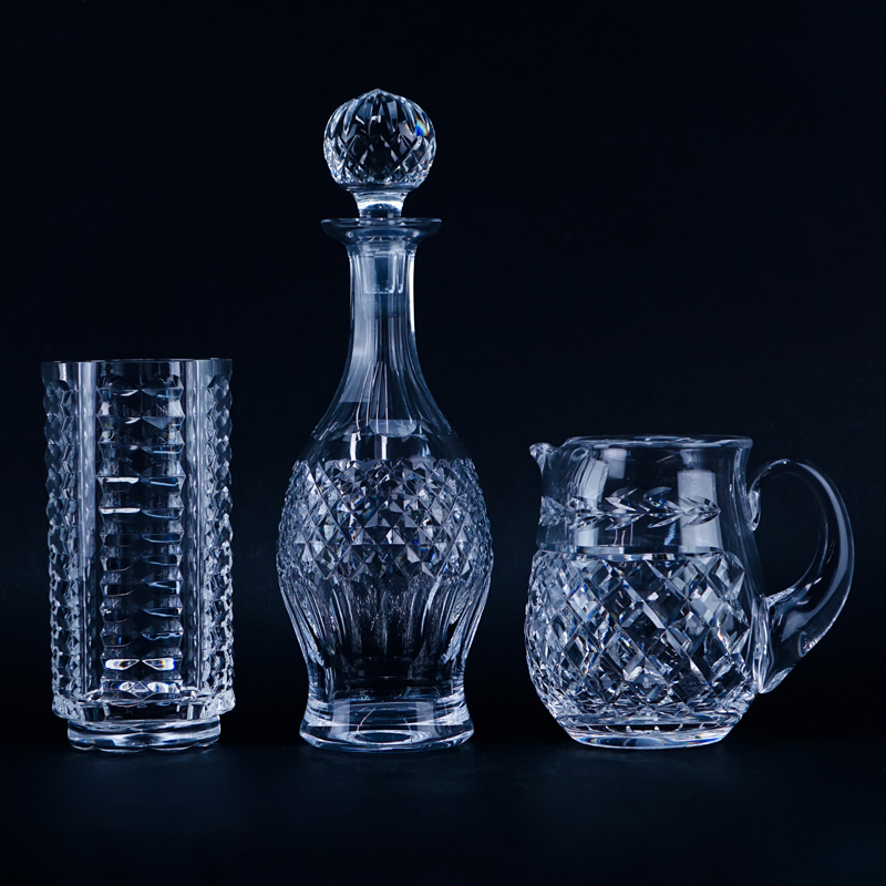 Three (3) Waterford Crystal Tableware. Includes: decanter, pitcher, and cylindrical vase.