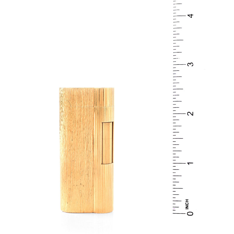 Vintage Dunhill Gold Plated Butane Lighter. Signed. Normal surface wear. Measures 2-9/16" H, 1-1/8" W.