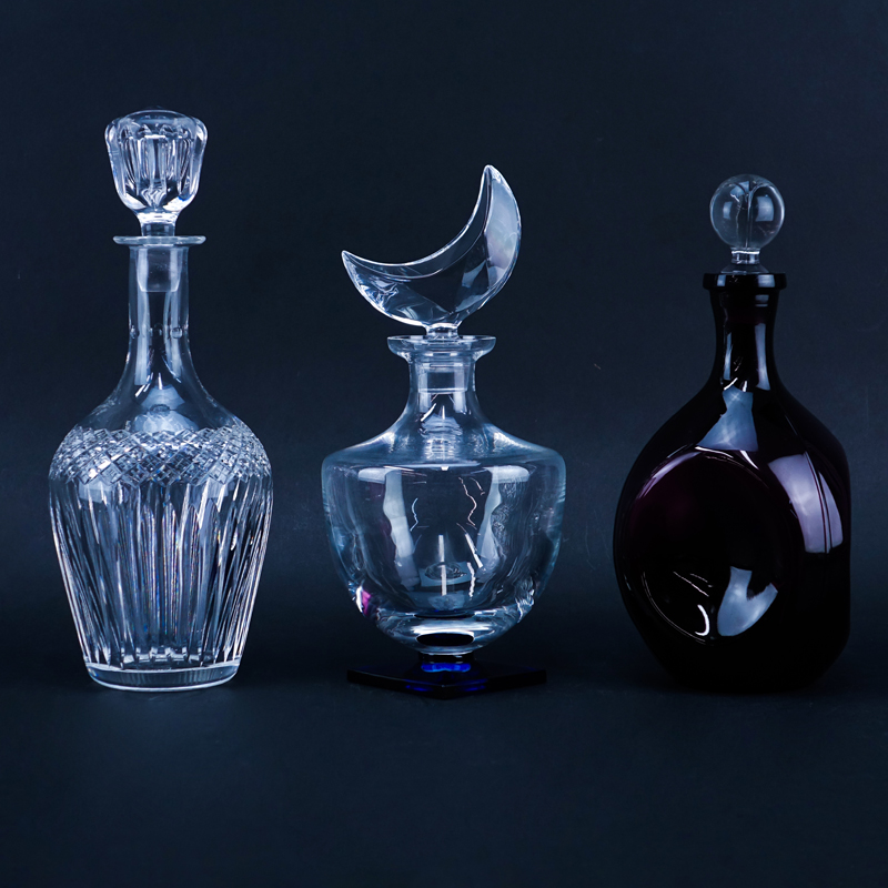Grouping of Three (3) Vintage Decanters. Includes: Hawkes crystal, Sevres crystal, and amethyst glass.