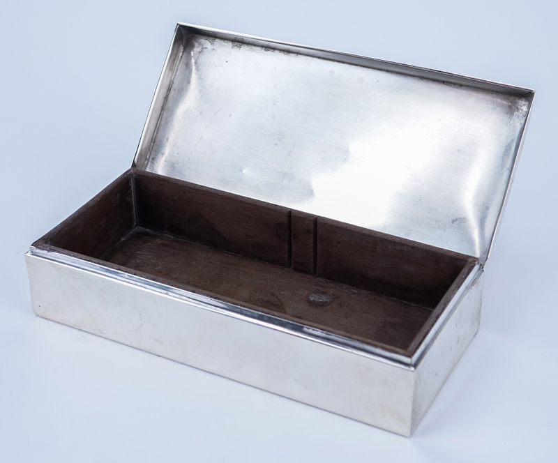 Poole Sterling Silver Cigarette Box. Wood lined. Signed. Good condition. Measures 2" H x 7-1/2" L x 3-1/4" D.