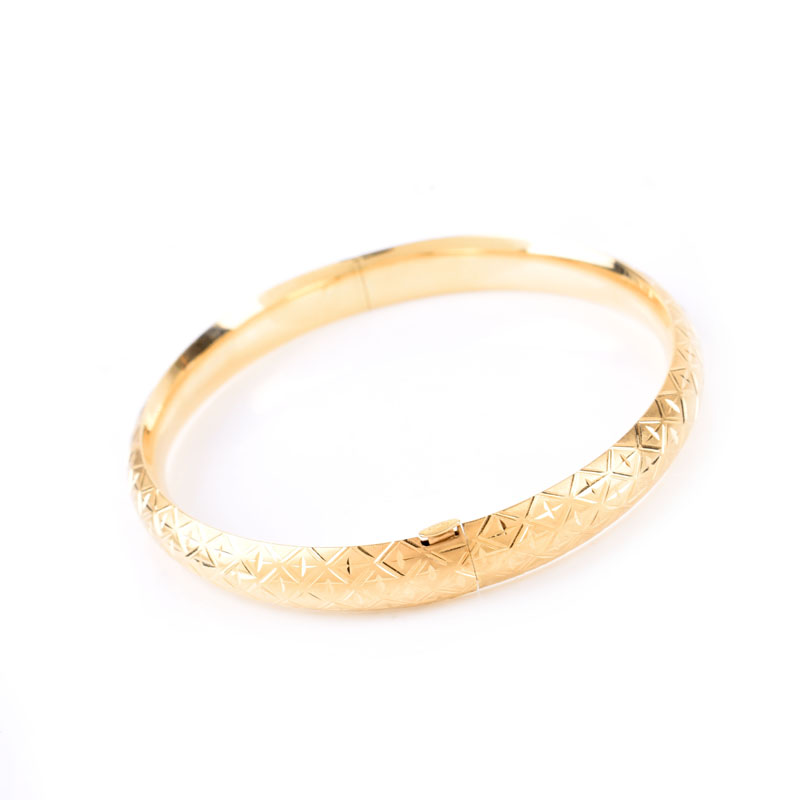 Pair of Vintage 14 Karat Yellow Gold Hinged Bangle Bracelets. Stamped 14K.