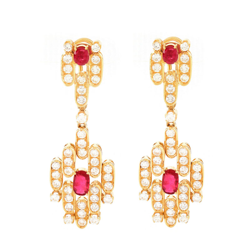 Vintage Approx. 7.50 Carat Round Brilliant Cut Diamond, 3.50 Carat Oval and Round Cut Ruby and 18 Karat Yellow Gold Pendant Earrings, en suite with the previous lot.