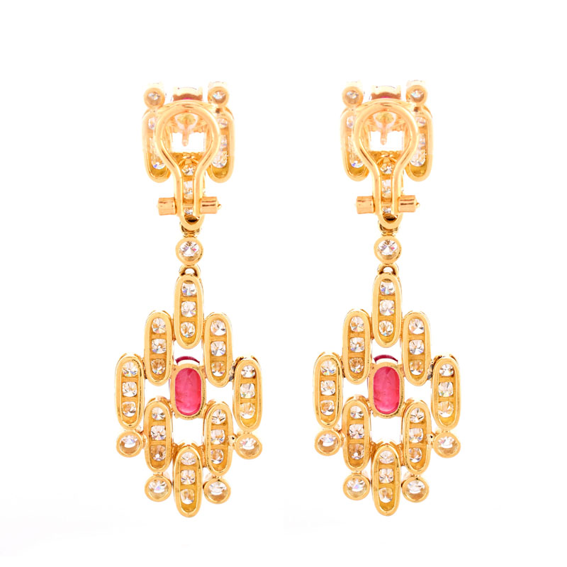 Vintage Approx. 7.50 Carat Round Brilliant Cut Diamond, 3.50 Carat Oval and Round Cut Ruby and 18 Karat Yellow Gold Pendant Earrings, en suite with the previous lot.