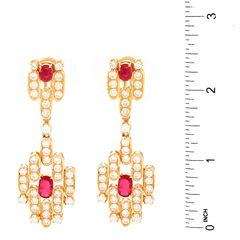 Vintage Approx. 7.50 Carat Round Brilliant Cut Diamond, 3.50 Carat Oval and Round Cut Ruby and 18 Karat Yellow Gold Pendant Earrings, en suite with the previous lot.