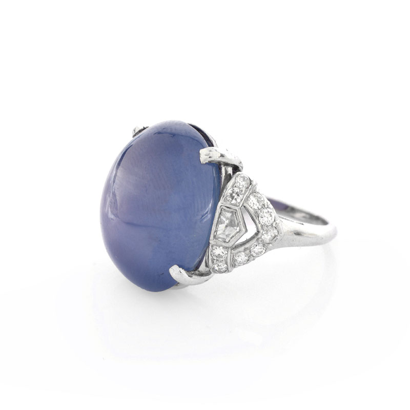 Art Deco Approx. 35.0 Carat Oval Cabochon Star Sapphire, .80 Carat Diamond and Platinum Ring.