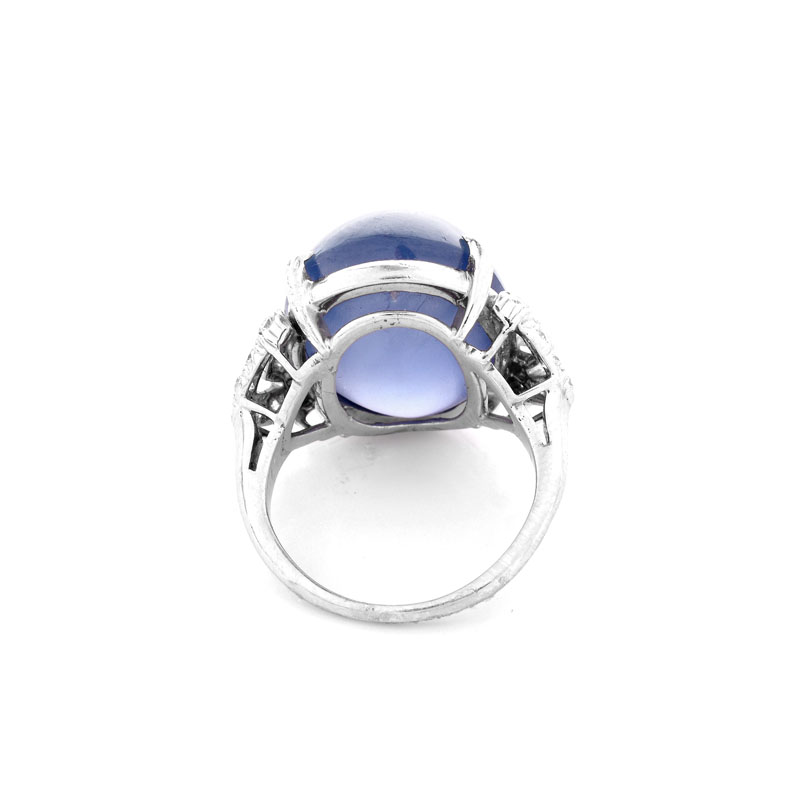 Art Deco Approx. 35.0 Carat Oval Cabochon Star Sapphire, .80 Carat Diamond and Platinum Ring.