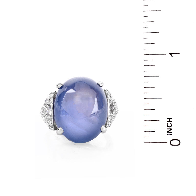 Art Deco Approx. 35.0 Carat Oval Cabochon Star Sapphire, .80 Carat Diamond and Platinum Ring.