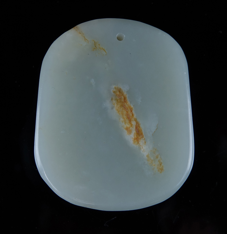 A Chinese Carved Celadon Jade Pendant with Buddha Relief.