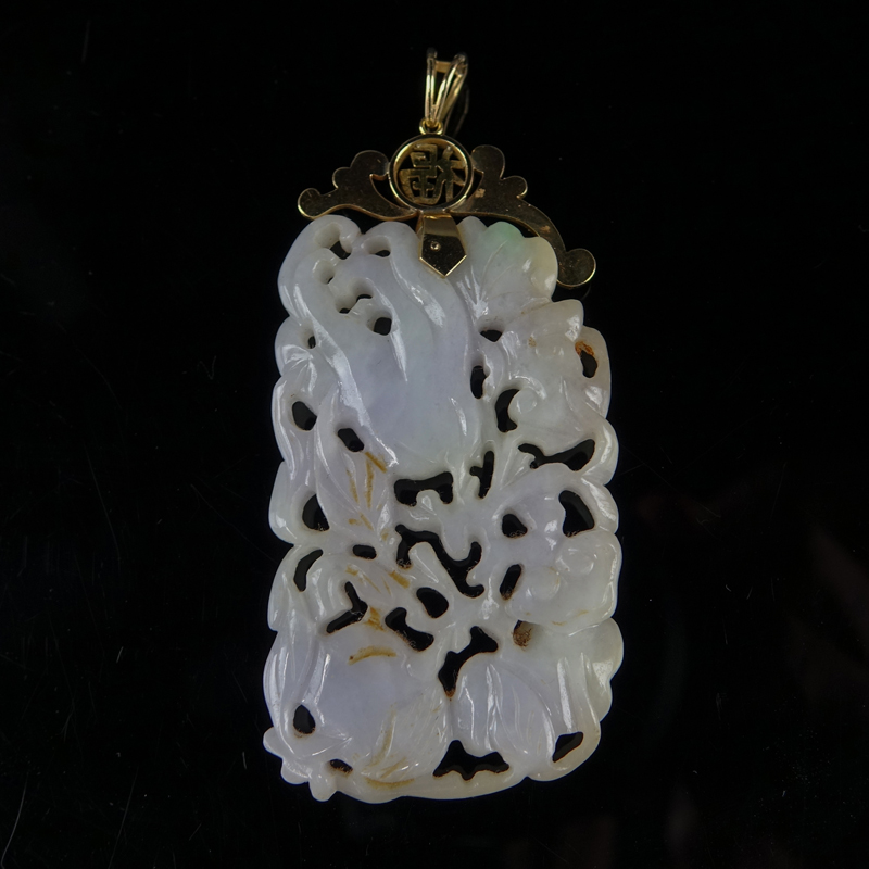 Antique Chinese Carved Lavender and Apple Green Jade Reticulated Floral Relief Pendant Mounted in 14 Karat Yellow Gold.