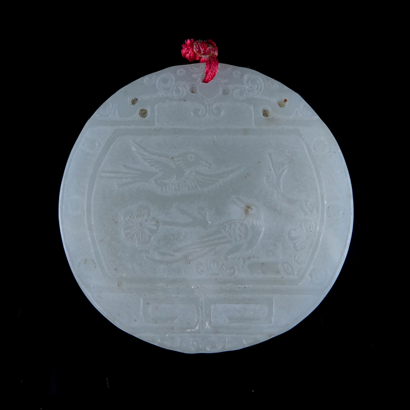 A Chinese Carved Light Celadon Jade Circular Pendant. Birds in nature with archaic patterns.