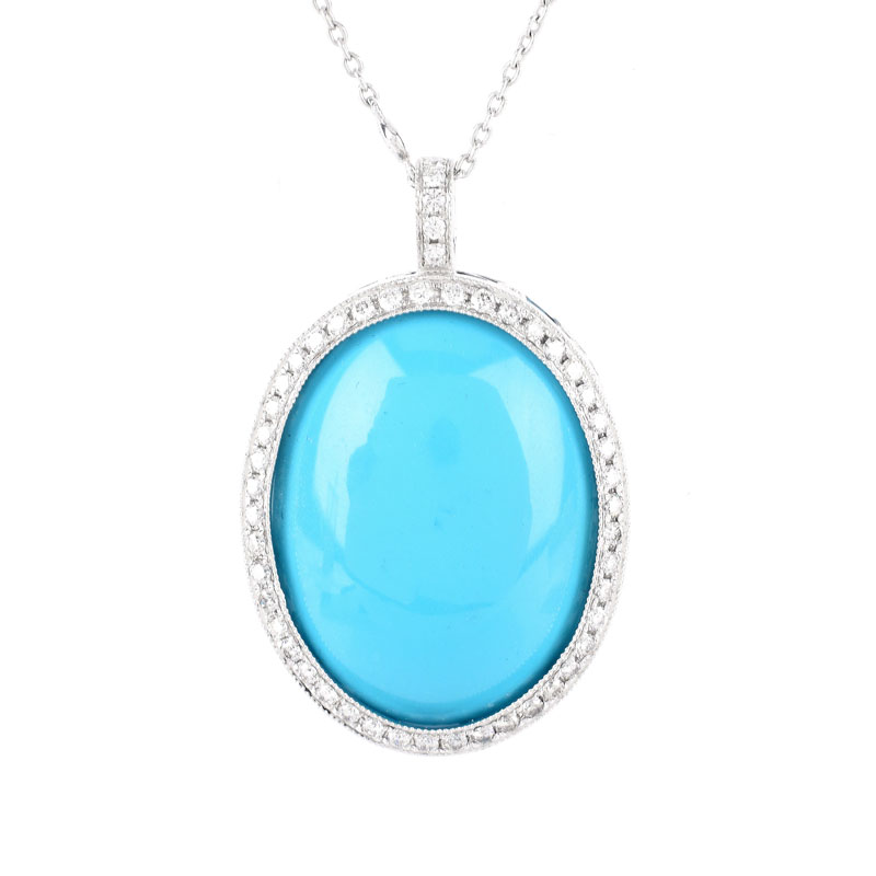 Large Oval Cabochon Persian Turquoise, 1.50 Carat Round Brilliant Cut Diamond and 18 Karat White Gold Pendant with 14 Karat White Gold Chain. Pendant stamped 18K 750, chain stamped 14K. 