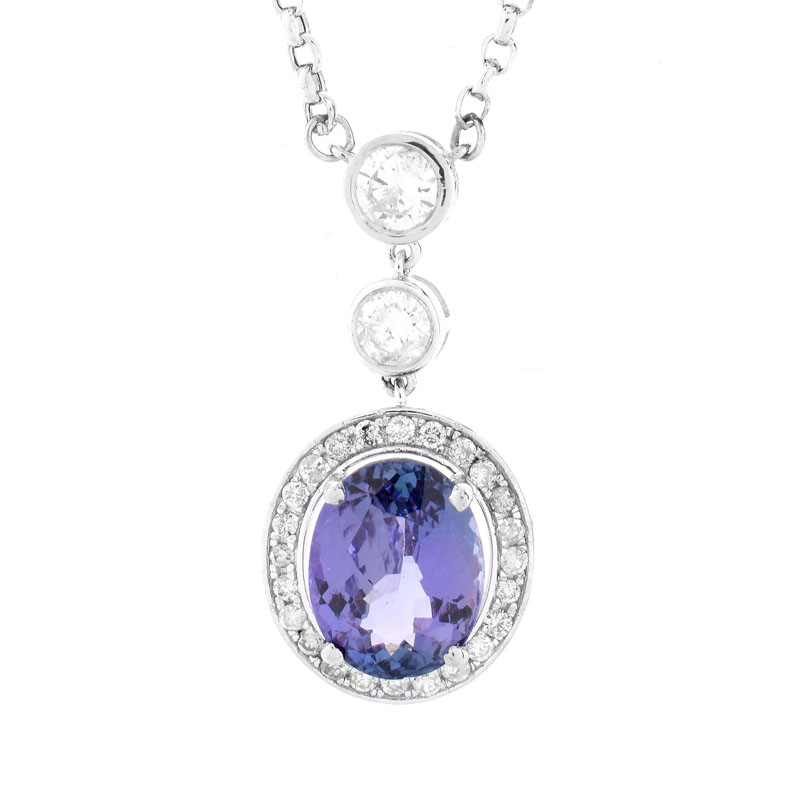 GIA Certified 4.65 Carat Oval Cut Tanzanite, 1.0 Carat Round Brilliant Cut Diamond and 18 Karat White Gold Pendant Necklace.