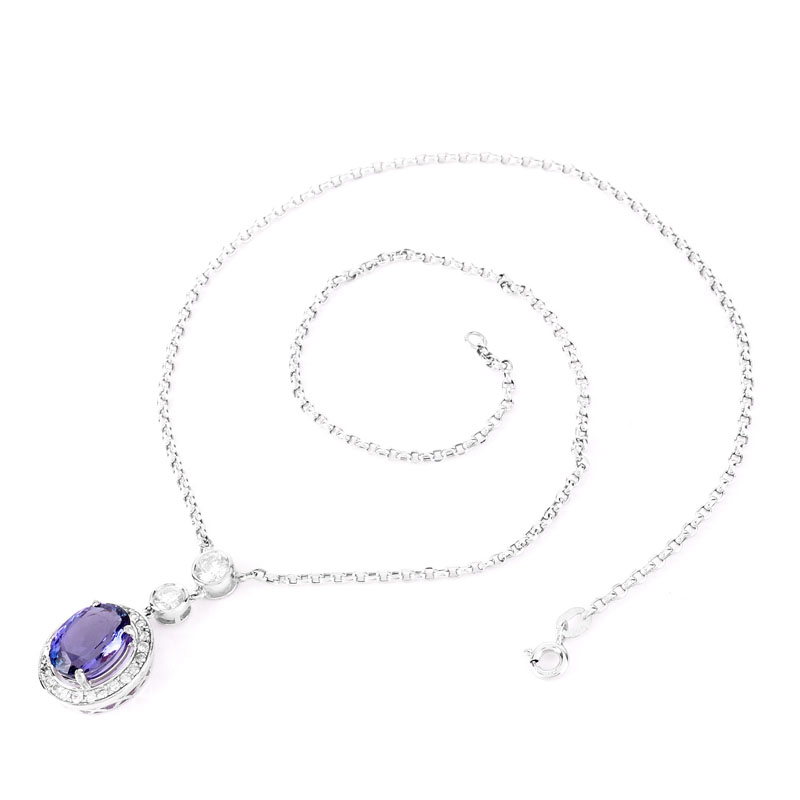 GIA Certified 4.65 Carat Oval Cut Tanzanite, 1.0 Carat Round Brilliant Cut Diamond and 18 Karat White Gold Pendant Necklace.