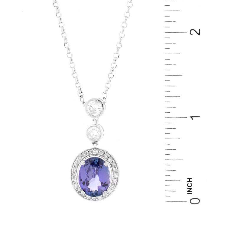 GIA Certified 4.65 Carat Oval Cut Tanzanite, 1.0 Carat Round Brilliant Cut Diamond and 18 Karat White Gold Pendant Necklace.