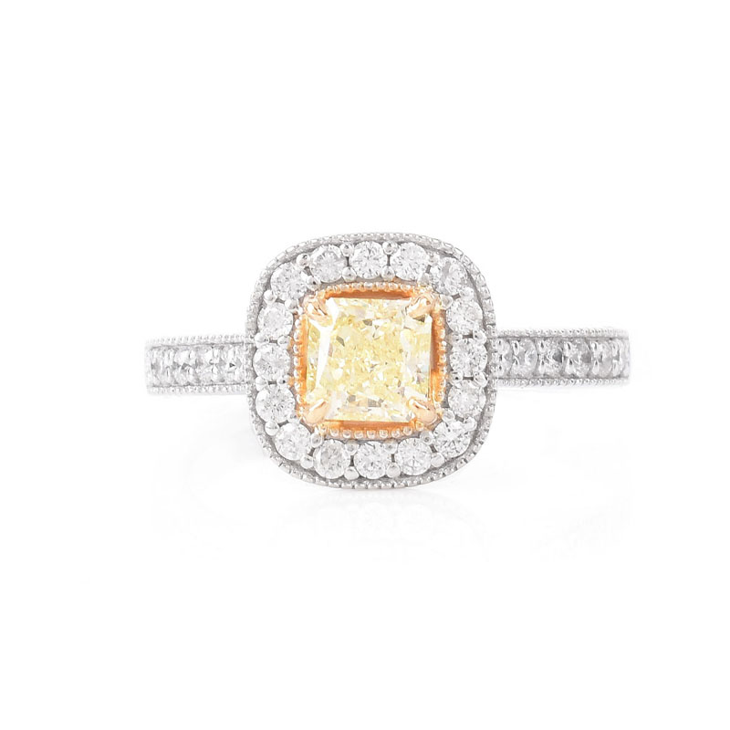 GIA Certified .59 Carat Fancy Yellow Diamond, .65 Carat Round Brilliant Cut Diamond and 18 Karat White and Yellow Gold Engagement Ring. Yellow diamond SI2 clarity.
