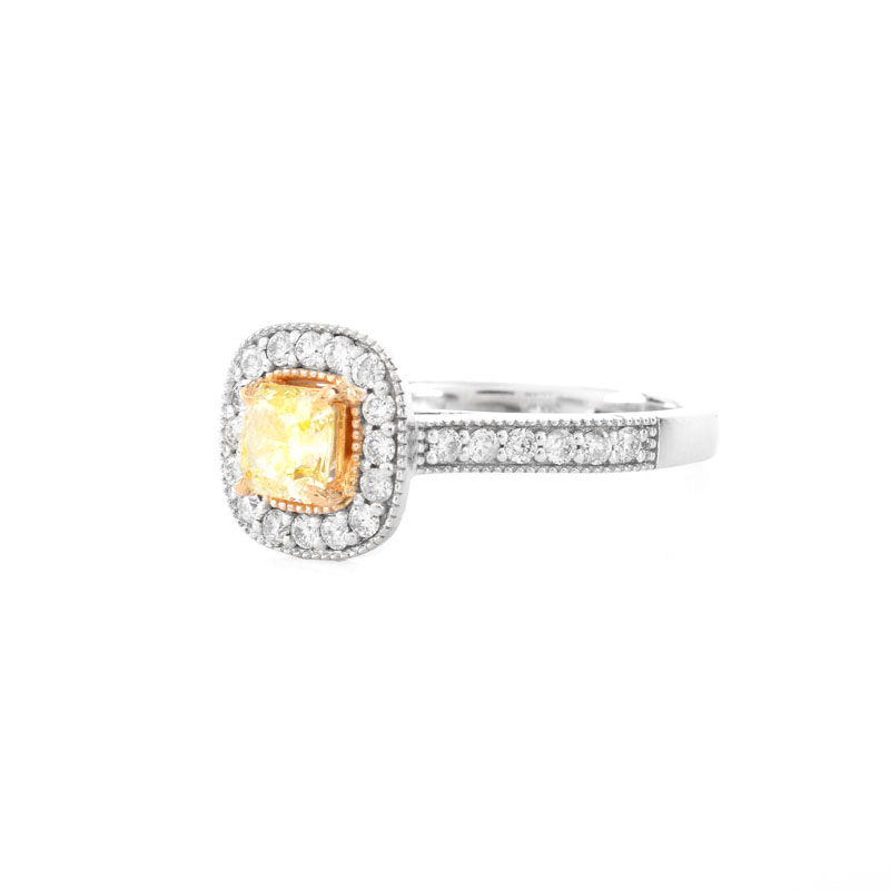 GIA Certified .59 Carat Fancy Yellow Diamond, .65 Carat Round Brilliant Cut Diamond and 18 Karat White and Yellow Gold Engagement Ring. Yellow diamond SI2 clarity.