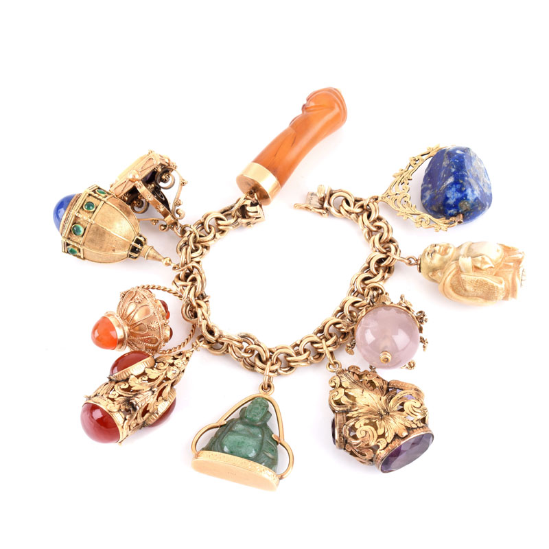 Vintage 14 Karat Yellow Gold Charm Bracelet with Ten (10) Large Antique and Vintage Charms Including Watch Fobs and Pendants.