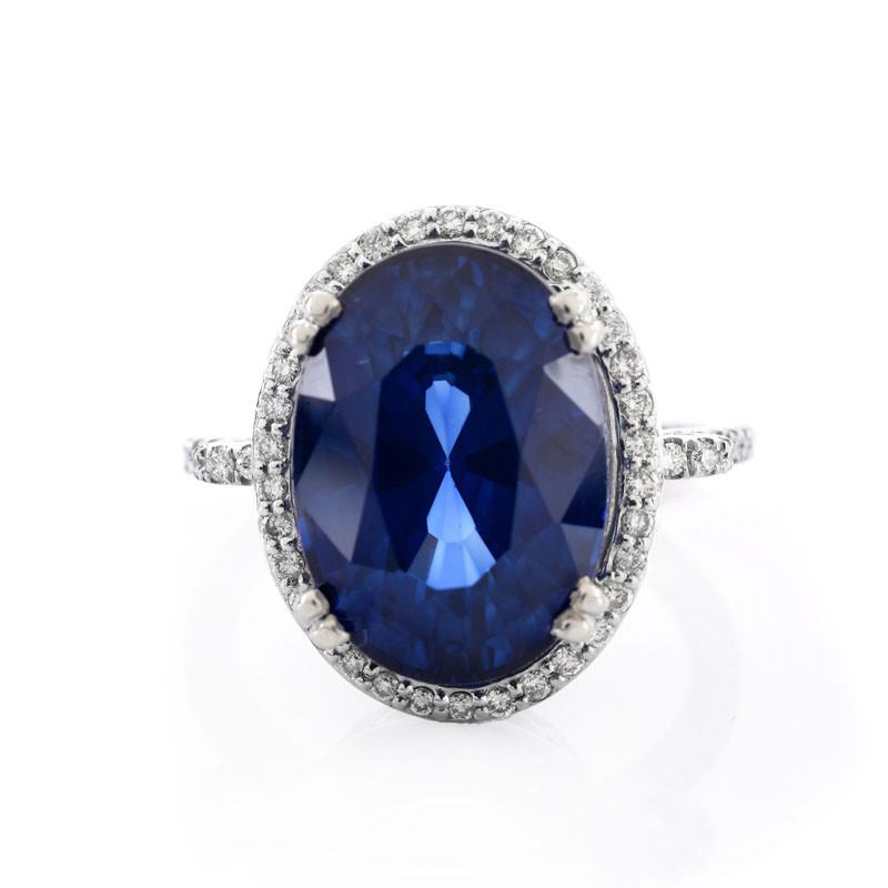 Oval Cut Sapphire, Diamond and 14 Karat White Gold Ring. Sapphire with vivid violet blue color, measures 15mm x 11.5mm.
