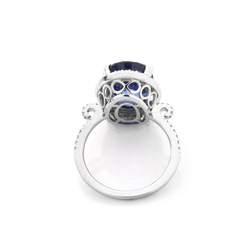 Oval Cut Sapphire, Diamond and 14 Karat White Gold Ring. Sapphire with vivid violet blue color, measures 15mm x 11.5mm.