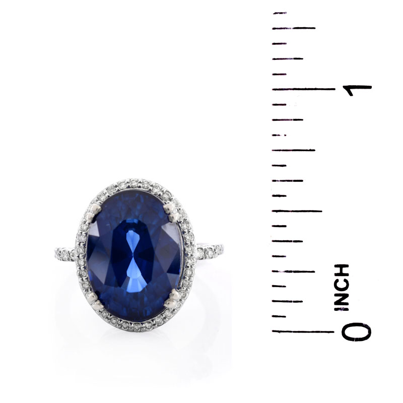 Oval Cut Sapphire, Diamond and 14 Karat White Gold Ring. Sapphire with vivid violet blue color, measures 15mm x 11.5mm.