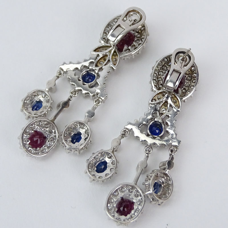 Vintage Approx. 7.0 carat Round Brilliant Cut Diamond, Oval Cut Rubies and Sapphires and 14 Karat White Gold Chandelier Earrings. 