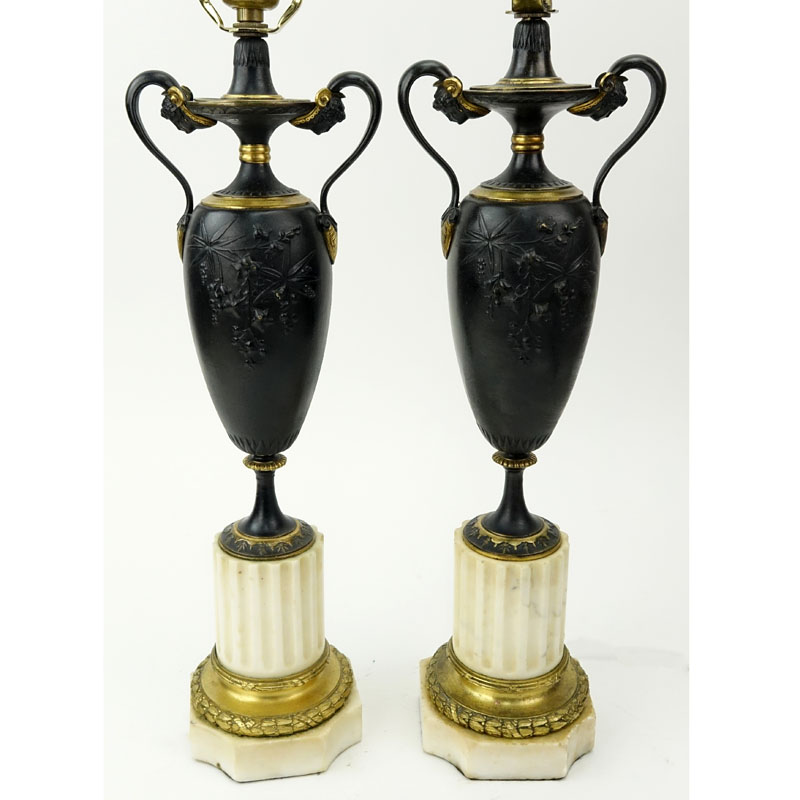 Pair Antique Louis XVI Style Bronze Urn Lamps. Patinated and gilt bronze on marble bases. Unsigned.