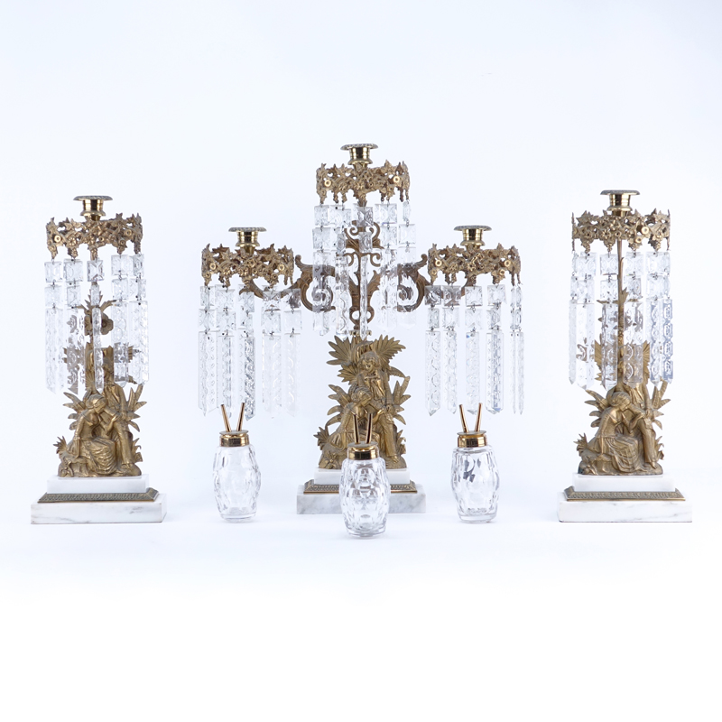 Antique Gilt Brass and Hanging Crystal Three Arm Figural Lamp with Candlesticks Set. Includes three oil canisters.