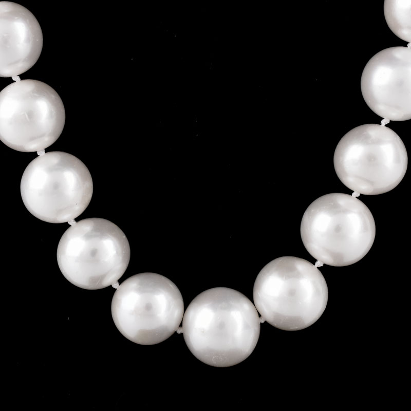 Single Strand Thirty Three (33) 13-15mm South Sea Pearl Necklace with 14 Karat Yellow Gold Clasp.