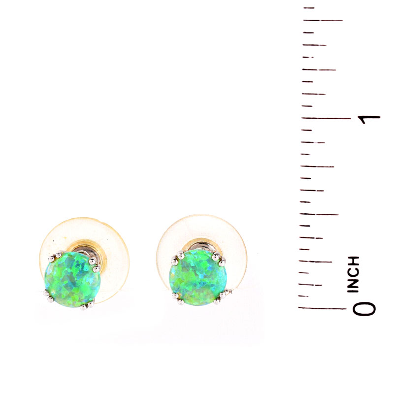 Vintage Black Opal and 14 Karat White Gold Stud Earrings. Opals measure 8mm diam. Stamped 14K.