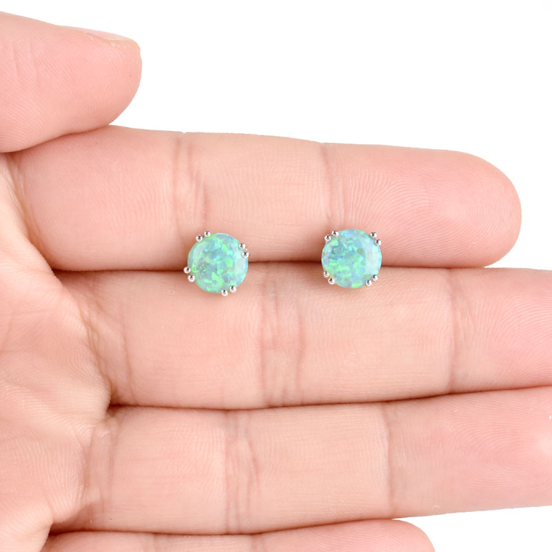 Vintage Black Opal and 14 Karat White Gold Stud Earrings. Opals measure 8mm diam. Stamped 14K.