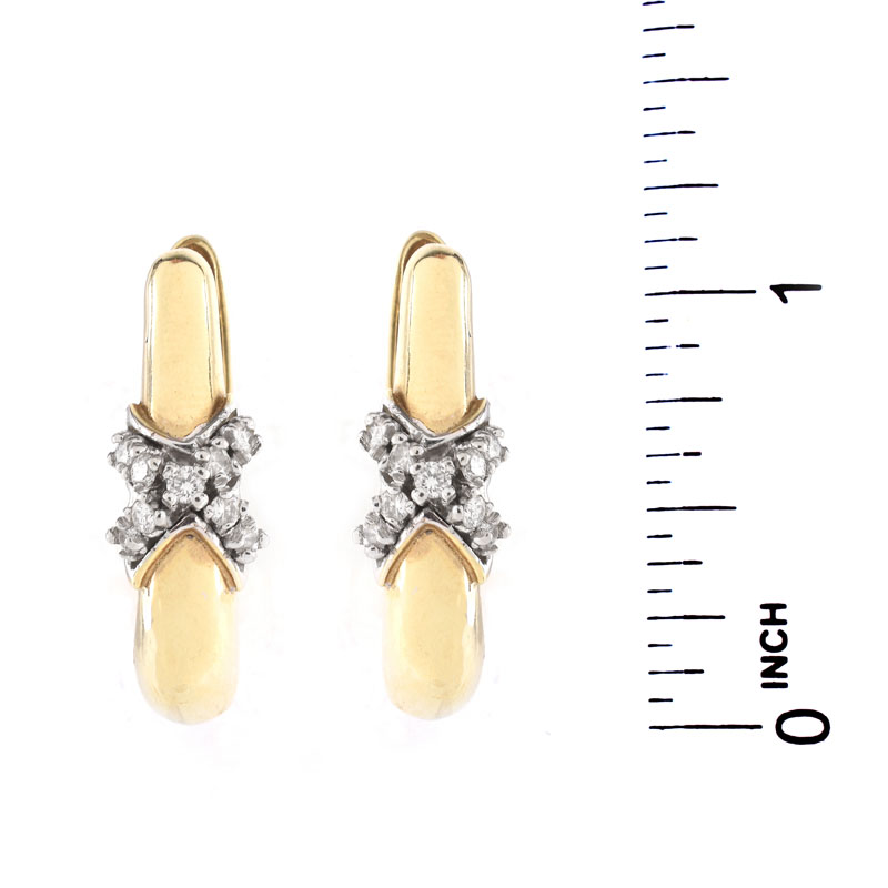 Vintage 14 Karat Yellow Gold and Diamond Earrings. Unsigned. Very good condition. Measure 1" L, 5/16" W. 
