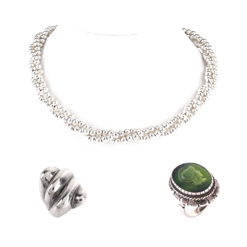 Italian Sterling Silver Bead Multi-strand Necklace, a Sterling Silver and Carved Green Stone Cameo Ring and a Sterling Silver Ring. 