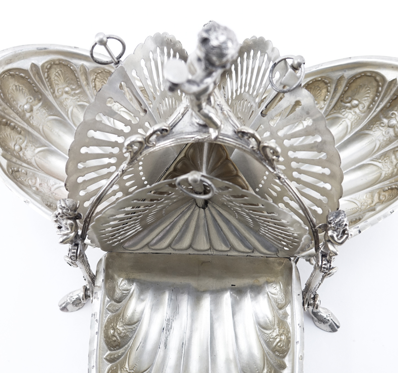 Victorian Silver Plate Tri-Fold Bun Warmer. Decorated with chased Rococo design and figural putti finials. Signed. Good condition.