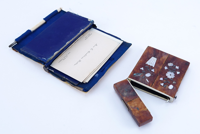 Two (2) Antique Card Cases. One of tortoise with inlaid Mother Of Pearl, the other of Ivory with leather interior and silver cartouche.