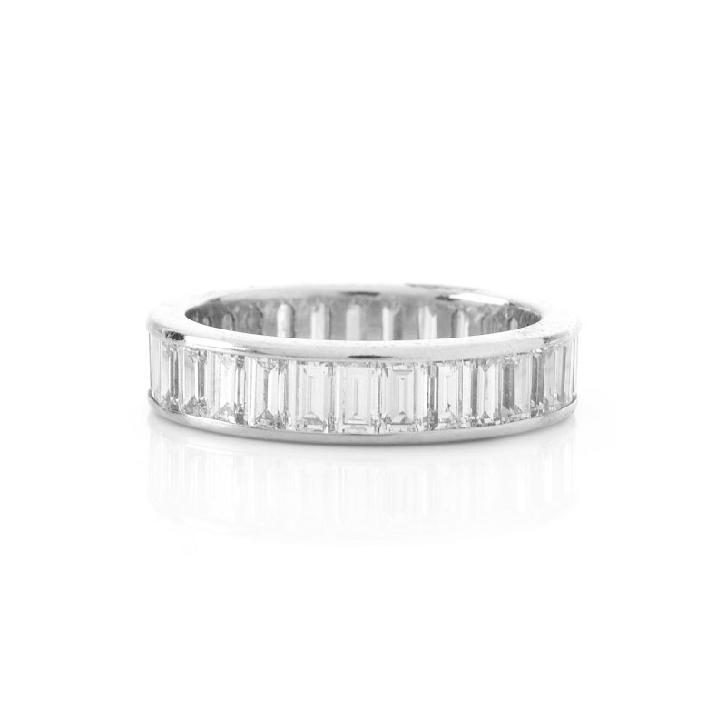 Approx. 4.25 Carat Baguette Cut Diamond and Platinum Eternity Band. Diamonds F-G color, VS clarity.