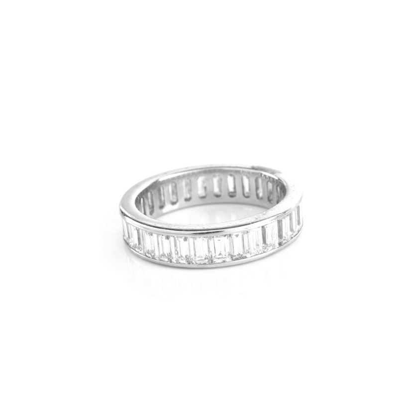 Approx. 4.25 Carat Baguette Cut Diamond and Platinum Eternity Band. Diamonds F-G color, VS clarity.