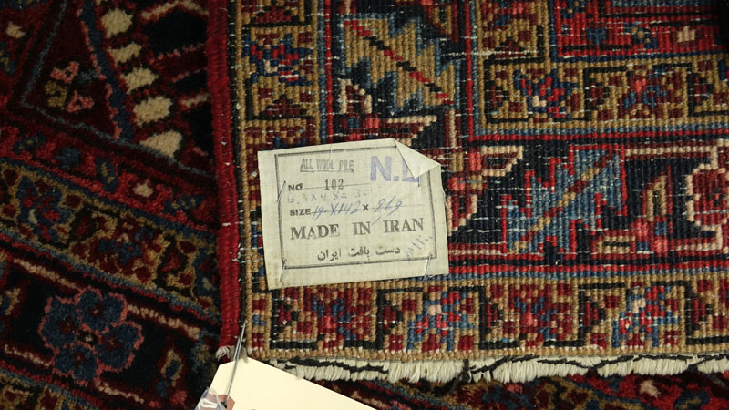 Semi Antique Persian Wool Oriental Rug. Label on underside. Loss to fringes, some typical discoloration, wear to fringes, dirty.