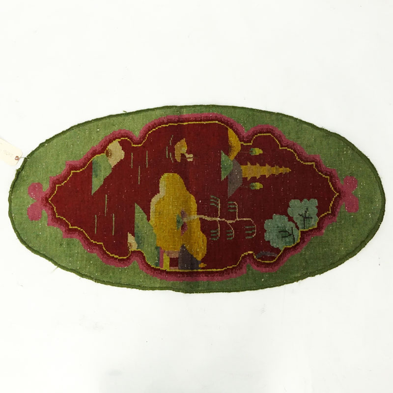 Chinese Nichols Rug: Oval shape with green and red colors. Fading, fraying to edges, dirty, needs cleaning.