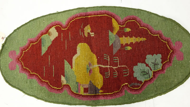 Chinese Nichols Rug: Oval shape with green and red colors. Fading, fraying to edges, dirty, needs cleaning.