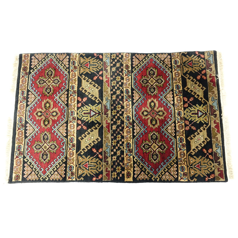 Black Oriental Rug. Numbered on underside. Stains to fringes, dirty. Measures 61" H x 38" W.